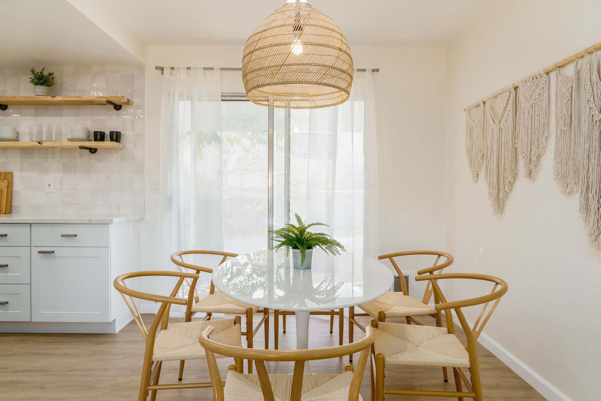 Minimalist Dining Area with White Table and Light Wood Chairs